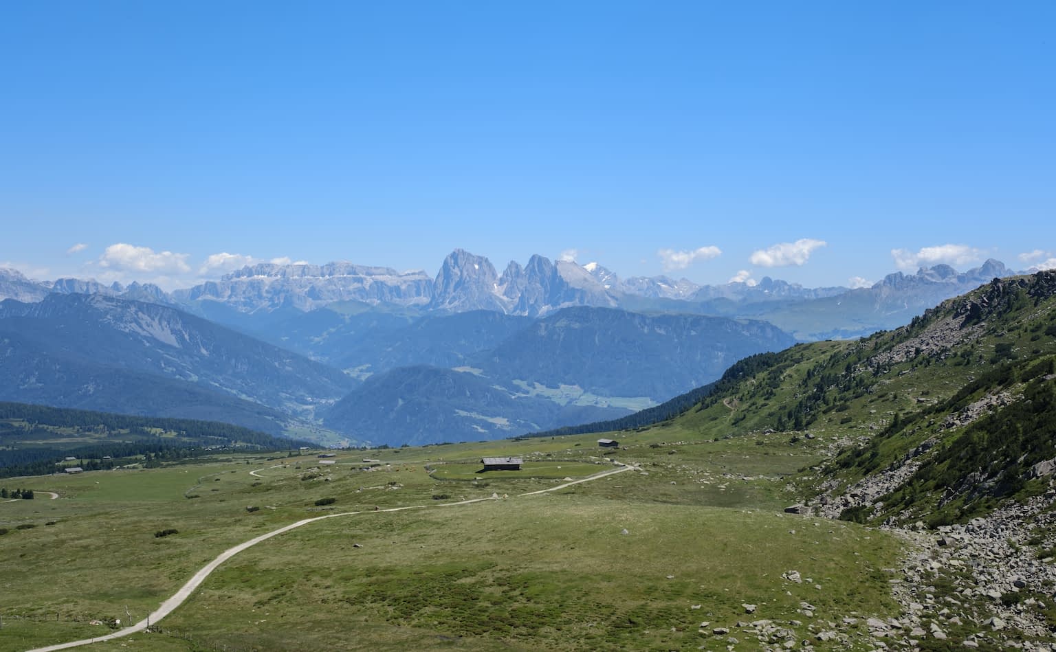 The mountain ranges Sella group and Langkofel group as seen from the Totensee in Villanderer Alm